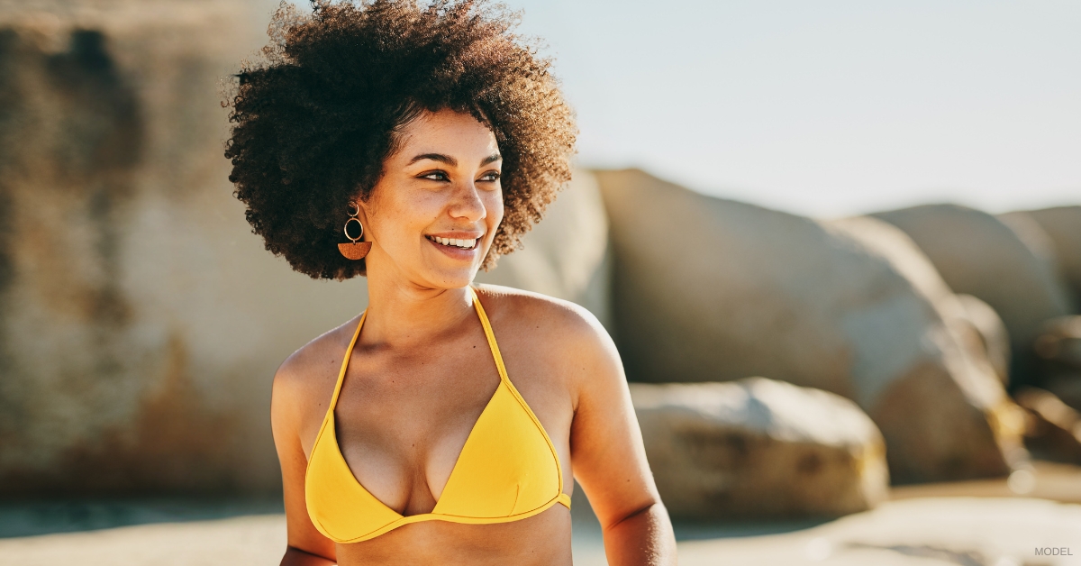 Woman showcasing breast lift results (Model)